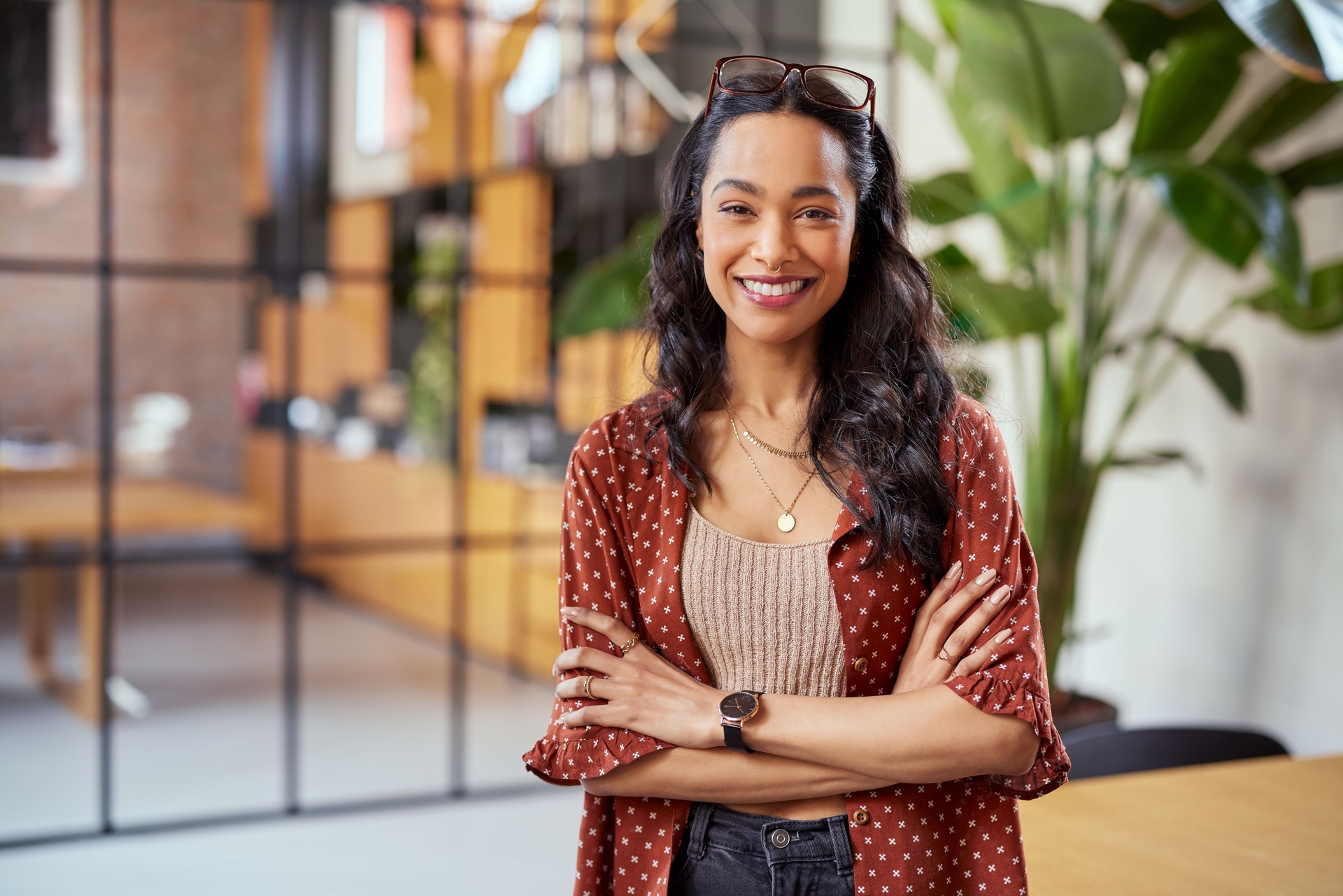 Smiling confident latin woman looking at camera